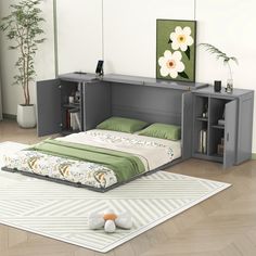 a bed sitting on top of a wooden floor next to a book shelf