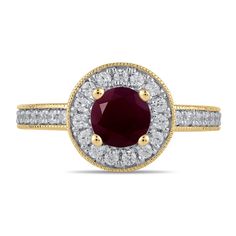 an oval shaped ruby and diamond ring with two rows of diamonds around the band, set in 18k yellow gold