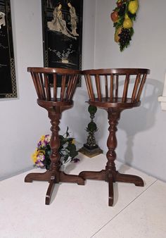 two wooden baskets sitting next to each other on top of a white counter in a room