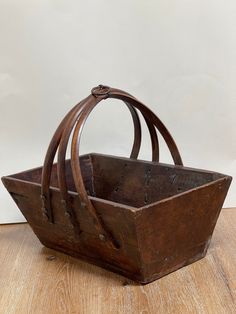 Add a touch of rustic charm to your home with this vintage wood primitive box. This antique wooden trug basket features a sturdy handle, making it perfect for both decorative and functional use. Its timeless design and weathered finish make it a versatile piece that fits seamlessly into neutral and farmhouse decor. Use it to store small items, display seasonal decorations, or simply as a charming accent piece. This rustic wood box brings a piece of history and a warm, cozy feel to any space. Mea Trug Basket, Rustic Wood Box, Box With Handle, Wood Basket, Decorative Baskets, Seasonal Decorations, Rustic Farmhouse Decor, Neutral Decor, Rustic Wedding Decor