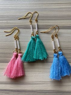 "I feel like these are so perfect for summer! Cute little tassels hanging from a beaded bar. Approximately 2\" long." Summer Beach Dangle Tassel Earrings, Summer Beach Tassel Earrings With Latkans, Spring Beach Tassel Earrings, Bohemian Tassel Earrings With Fringe For Spring, Spring Beach Jewelry With Tassels, Elegant Summer Tassel Earrings With Dangling Beads, Trendy White Tassel Earrings For Summer, Trendy Dangle Tassel Earrings For Summer, Handmade Tassel Earrings For Spring Beach