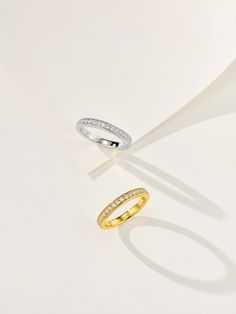 This minimalist stacking ring is crafted from 925 sterling silver with a luxurious gold-plated finish. Featuring a delicate row of sparkling diamonds, it offers a refined yet captivating look. Perfect for stacking or wearing alone, this ring adds a touch of elegance to any outfit, making it an ideal choice for everyday wear. Metal: 18K Recycled Gold Plated Vermeil on Recycled Sterling Silver/Recycled Sterling Silver Gemstone: Cubic Zirconia Ring Sizes Available: 5, 6, 7, 8(US) Classic Stackable Rings With Diamond Accents As Gift, Elegant Midi Rings With Diamond Accents For Anniversary, Elegant Midi Rings For Anniversary, Stackable Diamond Midi Rings With Round Band, Stackable Diamond Midi Rings, Minimalist Gold Midi Rings With Diamond Accents, Modern Stackable Diamond Midi Rings, Classic Stackable Cubic Zirconia Rings, Minimalist Stackable Diamond Rings With Accents