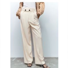 Brand New. High Waisted Pant. Front Hook And Zip Closure. Side Pockets. Ecru Color Elegant High-waisted Off White Pants, Trendy Beige Office Pants, Trendy Beige Pants For Office, Elegant White Wide Leg Pants With Belt Loops, Chic Beige Wide Leg Pants With Belt Loops, Elegant Off White Workwear Pants, Trendy Beige Pants For Work, Cream Trousers For Office, Cream Trousers For Office Wear