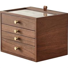 a wooden box with three drawers on the front and one drawer open to show an empty container