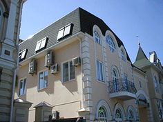 an apartment building with many windows and balconies