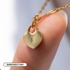 "Elevate your look with our High-Quality Heart Initial Tag Necklace - a timeless treasure for all! It's perfect for toddler girls and your mother. Materials & Finish: * 316L Stainless Steel * 14k Gold, Silver * Our products differ from regular gold plating because they are a thicker layer of 14k gold on 316L Stainless Steel, making them more durable. It offers the appearance and quality of gold jewelry at a more affordable cost. Size Specs: * Heart Initial Tag Dimensions:  10mm x 12mm * Chain Lengths: Available in multiple sizes (please select from the dropdown menu) * Necklace comes with a 2\" adjustable extender for fine-tuning. Link for just Charm: * https://www.etsy.com/listing/1325115090/add-on-gold-initial-pendant-add-letter Features: * Minimalist Personalized Design * Waterproof, Sw Valentine's Day Engraved Heart Pendant Initial Necklace, Everyday Heart-shaped Initial Necklace For Mother's Day, Personalized Heart-shaped Initial Necklace, Valentine’s Day Initials Pendant Necklace, Heart-shaped Initial Necklace For Valentine's Day, Engraved Heart Necklace, Initial Tag Necklace, Gold Initial Pendant, Letter Pendant Necklace