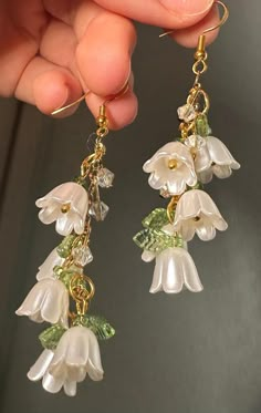 🎀Handmade earrings by Kali🎀 Stylish, Dainty, Classy, Good quality, Unique earrings, Perfect gift for her, weddings, anniversaries, and even birthdays. These alluring earrings are thoughtfully made with love, creativity, and precision. The perfect pair of classy white earrings. Inspired by the beauty of nature, flowers, leaves, and shimmering beads. ~M A T E R I A L S~ Made with care, using durable, hypoallergenic stainless steel. Earrings are nickel, tarnish and rust free. ~C A R E~ -Don't wear earrings when exercising or doing physically strenuous activities  -Don't stretch or pull earrings -Rust free, safe for water use but not recommended in order to preserve best quality  🎁Package: small, cute, jewelry earring box with bow. ~A B O U T   M E~ Hi there, my name is Kalina! I'm a Bulgar Popular Earrings 2024, Cottage Core Gifts, Midsummer Party, Whimsical Earrings, White Flower Earrings, Cottagecore Earrings, Gold Flower Earrings, White Flower Earring, Flower Earrings Gold