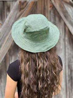 Eco-friendly Hemp Wide Brim Sun Hat – Solid Available in Natural, Black, Navy, or Olive Eco-friendly Hemp Sun Hat - Solid Our hemp sun hat is perfect for any time or anywhere..at the beach, pool, gardening, festival or just hanging around. Solid Color options: Natural, Green, Black, or Navy Hemp sun hat made from 100% hemp with a soft organic cotton lining, wire brim makes it easy to reshape. Wide brim perfect to protect your head and face from too much sun. This hat is lightweight and flexible so that can be folded for easy carrying. Easily gets back in shape 100% Hemp Adult size - available in One Size Suitable for 21 inch - 23 inch Head brim at widest point - 2 1/2 - 3 inches Crown height - 4 inches Why Hemp: Hemp fiber is lightweight and water absorbent Durable, long-lasting, and stron Bohemian Lightweight Sun Hat, Casual Natural Bucket Hat With Flat Brim, Bohemian Lightweight Brimmed Hat, Bohemian Brimmed Lightweight Hat, Eco-friendly Woven Sun Hat For Spring, Cotton Bucket Hat For Summer Festivals, Green Beachy Hat For Beach Season, Lightweight Bohemian Hat With Curved Brim, Lightweight Bohemian Sun Hat For Warm Weather