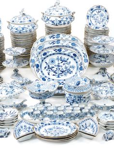 a collection of blue and white china