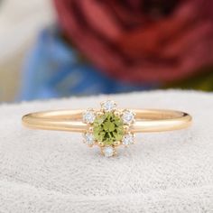 Description : Round Shaped Green Peridot Engagement 14K Solid Gold Ring, Certificated Genuine Peridot Diamond Wedding Ring, Peridot Birthstone Rings Diamond : 0.07 CT. F / SI (6 piece) Natural Green Peridot : 0.16 CT. (1 piece) Gram 1.33 (It may differ depending on the ring size) Product Code: MR0011859 This product belongs to Tilya Jewelery private collection . You can browse our store for other special collection products. All of our products are stamped and made of solid gold . All of our pro Peridot And Diamond Rings, Green Sapphire Ring In 14k Gold For Wedding, Green Sapphire Ring With Round Cut For Wedding, Green Cluster Ring With Halo, Peridot Birthstone Ring For Wedding, Fine Jewelry Peridot Diamond Wedding Ring, Wedding Cluster Ring In Green With Round Cut, Fine Jewelry Peridot Diamond Ring For Wedding, Green Birthstone Ring With Center Stone For Wedding