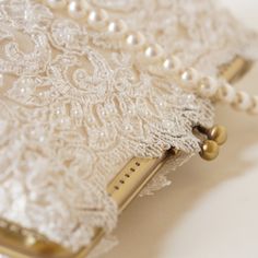 • Ivory Capri Clutch • Pearl White Clutch For Wedding, Pearl White Wedding Clutch With Pearl Handle, Elegant Bridal Accessories With Pearl Embroidery For Ceremony, Vintage Beige Clutch For Wedding, Beige Wedding Clutch With Pearl Handle, Vintage Beige Wedding Clutch, Elegant White Clutch For Ceremony, Elegant Rectangular Clutch For Mother Of The Bride, Elegant Lace Bridal Accessories For Formal Occasions