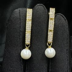 Add a touch of timeless elegance to your jewellery collection with this stunning white pearls earrings. Materials: 8mm shell pearls, gold or platinum plated brass earrings with inlaid zircon. Shell pearls are made from crushed shells. Oyster shells are cut and transformed into powder and then reformed into perfect pearl shape with an infinite shine.  They are very popular as a natural alternative to expensive pearls.  Matching choker here: https://perlettejewellery.etsy.com/listing/1748630709 Ma Pearls Earrings, White Pearl Earring, Oyster Shells, Earrings Pearl, Matching Bracelets, Brass Earrings, Pearl Drop, Jewellery Collection, Bridal Earrings