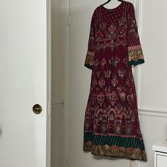 Worn Only Once And Is In Excellent Condition This Is A Stunning Embroidered Long Maxi Dress With Front And Back Both Embroidered The Pants Are Brand New They Have Not Been Worn The Dupatta Is A Stunning Net Piece With Two Different Style Borders Indian Pakistani Multicolor Embroidered Floor-length Dress, Festive Maxi Length Embroidered Dress With Floral Details, Long Embroidered Festive Dress, Long Floral Embroidered Festive Dress, Festive Multicolor Embroidered Embellished Dress, Festive Multicolor Embellished Embroidered Dress, Red Long Sleeve Embroidered Fitted Dress, Red Long Sleeve Dress With Intricate Embroidery, Festive Multicolor Embroidered Long Sleeve Dress