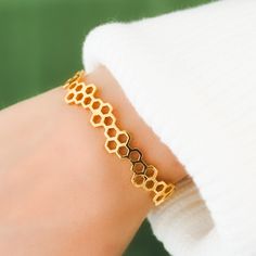 "Title: Hexagon Geometric Honey Comb Cuff Story:  Elevate your style with our striking hexagon geometric honeycomb cuff, intricately designed and brought to life through the art of 3D printing. The unique hexagon shape and honeycomb pattern lend a modern and contemporary flair to this adjustable cuff, ensuring a perfect fit for any wrist. Crafted with meticulous attention to detail, this cuff is a statement piece that seamlessly blends art and technology, adding a touch of sophistication to any Honeycomb Jewelry, Honey Bee Jewelry, Jewelry Cute, Bee Jewelry, Cute Rose, Honeycomb Pattern, Bangle Designs, Bracelet Cuff, Frozen 2