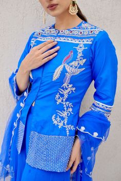 Royal blue short kurta embellished with bird and flower motif. Paired with a flared palazzo and a dupatta with scalloped embroidered border. - Aza Fashions Designer Embroidered Blue Traditional Wear, Designer Blue Blouse Piece With Motifs, Fitted Blue Kurta With Motifs, Blue Fitted Kurta With Motifs, Traditional Blue Top For Eid, Blue Embellished Top For Wedding, Designer Blue Traditional Wear With Dabka Work, Designer Blue Kurta With Motifs, Designer Blue Zari Work Set