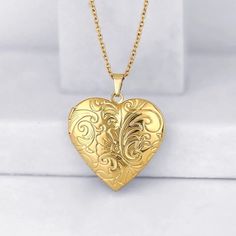 18K Gold Plated Flower Engraved Heart Locket  Photo Memory Pendant Necklace Heart Pendant Size:Approx 1.1"x1.1" Link Chain Length: Approx. 18"  Chain thickness: Approx: 2mm Metal: 18K Gold Plated Heart has a hinge that opens up to insert photo.  Care For Plated Jewelry  To avoid tarnish, limit exposure to water, perfume, Chemical or body cream etc. Please keep in the plastic bag while storing. Do not use silver or jewelry liquid cleaner, wipe with a jewelry cloth . *Due to the monitor difference Picture Pendant Necklace, Gold Heart Locket, Photo Care, Memorial Pendant, Picture Pendant, Water Perfume, Jewelry Heart, Heart Flower, Necklace Heart