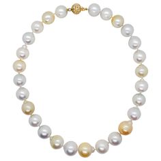 Beautiful necklace showcasing 27 white and yellow South Sea pearls and 0.50 ct. of white diamond rounds in a 18k yellow gold clasp. Superb luster and minimal to no blemishes. The alternating white and yellow pearls make this classic necklace unique and fun. Mint condition. Luxury High Luster White Pearl Necklace, Formal White Single Strand Diamond Necklace, White Pearl Diamond Necklace With Pearl Chain, White Diamond Necklace With Pearl Chain, Luxury White Pearl Chain Necklace, White High Luster Round Beads Necklace, White High Luster Round Beaded Necklaces, White High Luster Round Bead Necklaces, White High Luster Pearl Necklaces