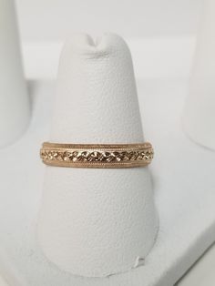 "Thanks for shopping our vintage estate store. We tend to sell well below wholesale and truly hope you enjoy all of our items. Many of the items are one of a kind, so please enjoy scrolling through the pictures and hopefully something will catch your eye. Brown spots are from the camera's reflection. Nice estate 14k yellow gold wedding band edged diamond cut design. Ring size: 6 Width: 4mm 3/16\" Weight: 2.46 grams Marked 14k as all our gold is marked or tested. We do not sell gold plated items. Vintage 14k Gold Stackable Jewelry, Classic Yellow Gold Band With Intricate Design, Gold Milgrain Round Band, Gold Milgrain Bands For Anniversary, Heirloom 14k Gold Band With Diamond Cut, Heirloom 14k Gold Diamond Cut Band, Heirloom Milgrain Bands For Anniversary, Heirloom Engraved Stackable Ring For Formal Occasions, Anniversary Yellow Gold Band With Decorative Detail