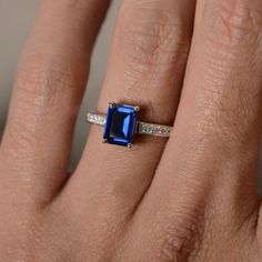 This is a gorgeous handmade creation. Its beauty is its simplicity & Elegance. The 6*8mm emerald shape faceted lab sapphire is crafted in solid sterling silver and with rhodium plated. All item is sent in a beautiful gift box You can realize more lovely stuff clicking the link https://www.etsy.com/shop/knightjewelry?refshopsection_shophome_leftnav Please leave the correct address and you phone number for delivering successfully. Emerald Cut Tanzanite Sapphire Ring, Blue Sapphire Ring In Emerald Cut Sterling Silver, Blue Emerald-cut Sapphire Ring In Sterling Silver, Radiant Cut Lab-created Sapphire Jewelry, Rectangular Lab-created Sapphire Rings, Gift Emerald Cut Tanzanite Sapphire Ring, Radiant Cut Tanzanite Jewelry Gift, Classic Sapphire Ring With Rectangular Stone, Sapphire Ring With Rectangular Stone For Anniversary