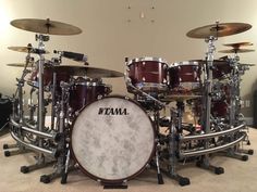 a set of drums sitting on top of a carpeted floor