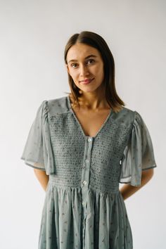 Add a touch of whimsy to your wardrobe with The Pineda Smocked Detail Midi Dress in Sage. This midi dress features a unique smocked detail that adds texture and interest, while the sage color adds a soft and playful touch. Perfect for any occasion, this dress is both stylish and fun! Details self/lining: 100% polyester Fabric Care Guide Here Sizing & Fit Measurements are approximate and taken while laying flat across the front. Not doubled. x-small: bust = 16"; length = 35" small: bust = 17"; le Henley Tee, Sage Color, Pattern Sweater, Cardigan Jacket, Light Weight Sweater, Small Bust, Stripe Sweater, Sweater Vest, Fabric Care