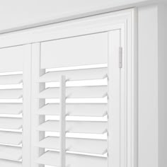 the shutters are closed to let in light on the room's white walls