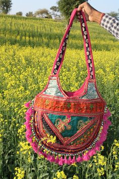 This is a handmade handcrafted very beautifull bag from barmer rajasthan india for multi purpose uses. Material:- -Cotton Cloths -Handmade items -Handmade designs -Embroidery -Embroided Front Usage Of Purpose:- -College -Market -Holidays Care Instructions:- -Wash it and dry it in the shade. Multicolor Rectangular Bag With Zari Work, Embroidered Shoulder Bag For Festivals, Handmade Multicolor Embroidered Potli Bag For Festivals, Multicolor Shoulder Bag With Dori Work For Festivals, Festival Rectangular Dori Work Shoulder Bag, Multicolor Handwork Potli Bag For Festivals, Traditional Handmade Bags For Navratri, Bollywood Style Shoulder Bag For Festivals, Bohemian Bags With Dori Work