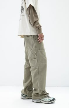 Discover practicality and style in PacSun's Olive Extreme Baggy Carpenter Jeans. Featuring utility pockets, a signature woven tag, spacious back pockets, and side entry pockets, these jeans are designed in an olive wash with durable seams. They boast a baggy fit with a wide leg opening for a relaxed, comfortable silhouette that merges utility with contemporary fashion.


	Model is wearing size 32
	Model Measurements: 6'0” Height, 28" Waist, 34” Chest, 32” Hips Baggy Jeans Design, Jeans Back Pocket Design, Baggy Pants Fashion, Carpenter Pants Outfit, Anatomy Clothes, Baggy Tshirt, Utility Wear, Mens Bottoms, Baggy Carpenter Jeans