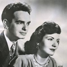 a black and white photo of two people