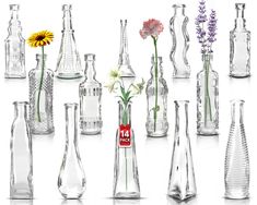 an assortment of vases with flowers in them