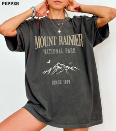 This Mount Rainier National Park comfort colors shirt is super soft and cozy. Perfect to lounge around, run errands, or walk your dog. ABOUT THIS SHIRT   ∙ Shirt is UNISEX and runs slightly large for ladies (For a relaxed fit, I suggest your usual size. For an oversized fit, I suggest sizing up 1 to 2 sizes.) ∙ 100% ring spun medium-weight cotton (soft-washed and garment-dyed) ∙ Colors may vary based on your monitor/screen display or lighting CARE INSTRUCTIONS ∙ Machine wash inside out in cold w Casual Gray T-shirt For Outdoor, Sporty Oversized Top For Outdoor, Gray Summer Outdoor Top, Oversized Short Sleeve Tops For Outdoor, Sporty Tops With Letter Print For Outdoor, Gray Crew Neck Top For Outdoor Activities, Gray Crew Neck Top For Outdoor, Oversized Letter Print T-shirt For Outdoor, Letter Print T-shirt For Outdoor In Spring