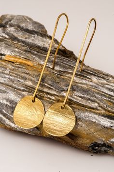 Round earrings golden perfect for gifts, thanks giving and Christmas and gift for her. You'll create an eye-catching look when you wear these Round Drop Earrings. These fashion earrings add shine to all your outfits. They feature a gold tone finish, drop design and round shape that you will love. These lightweight earrings come with classic hook closures for secure and comfortable wear, and they're made from high-quality copper material to suit most skin types. Wear them with a little black dres Gold Threader Earrings For Gift, Gold Round Threader Earrings, Gold Single Threader Earring, Single Gold Copper Earring, Nickel Free Recycled Gold Earrings For Gift, Nickel-free Recycled Gold Earrings As Gift, Single Round Gold Earring, Gold Dangle Threader Earrings As Gift, Gold Dangle Threader Earrings Nickel Free