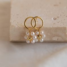 F L O W E R ∙ P E A R L ∙ E A R R I N G S These minimalist Flower Pearl Studs are a dream come true for every vintage jewelry lover. They're reminiscent of your family's passed down and treasured heirlooms. The dainty beaded charm shines perfectly in its daisy shaped form making it your first choice whenever you're in the mood for a floral summer vibe. * Material: High Quality Solid 925 Sterling Silver  * Finish: Sterling Silver ∙ 18K Gold * Featuring ~9.5mm Pearl Flower Dangling Charm with a ~1 Flower Pearl Earrings, Minimalist Flower, Pearl Anklet, R P, Beaded Anklets, Circle Studs, Pearl Flower, Delicate Earrings, Bridesmaid Earrings