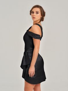 This feminine mini dress will make you feel irresistible with its gentle details. The intricate off-shoulder design features an asymmetric drape at the front, above-knee length and an invisible zip closure.  The dress is fully lined and its soft satin fabric will ensure you feel comfortable. It is fitted to the waist and shapes the body beautifully, bringing all eyes on you.  Choose this amazing look for your special occasion and enjoy every minute of wearing it! Hand wash only. Wash inside out Elegant Knee-length Ruched Off Shoulder Dress, Elegant Draped Off Shoulder Cocktail Dress, Ruched Off-shoulder Dress With Asymmetrical Neckline For Party, Evening Off-shoulder Dress With Asymmetrical Neckline And Ruched Detail, Ruched Off Shoulder Dress With Asymmetrical Neckline For Party, Party Off Shoulder Dress With Asymmetrical Neckline, Elegant Fitted Off Shoulder Dress With Draped Shape, Elegant Fitted Off Shoulder Dress With Draped Design, Elegant Fitted Draped Off Shoulder Dress