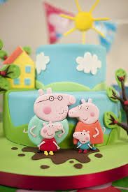 a pepo and pig family cake on top of a table