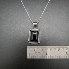 Visit our on-line shop at: Etsy.com/shop/AlbuquerqueDesigns *sterling silver necklace pendant *rectangle shape pendant with silver box chain necklace 18 inches long *southwestern jewelry *black onyx / black stone *calibrated pre-cut stones in millimeter and shape of stone: 14x10nn rectangle shape *back of jewelry items are all covered / do not show the back of stones *all jewelry items are made to ship, slight variations in stones will occur comparing to pictures. *size of a penny is 19mm or a d Classic Sterling Silver Necklace With Rectangular Pendant, Silver Sterling Silver Necklace With Rectangular Stone, Classic Silver Necklace With Rectangular Stone, Rectangular Black Necklaces For Gifts, Rectangular Stamped 925 Necklace As Gift, Rectangular Sterling Silver Necklace With Gemstone, Formal Black Rectangular Necklace, Sterling Silver Rectangular Gemstone Necklace, Black Jewelry With Rectangular Stone For Gift