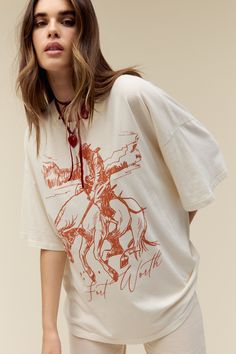 Casual T-shirt For Western-themed Fall Events, Spring Graphic Print T-shirt For Rodeo, Western Style Relaxed Fit Graphic T-shirt, Western Style Relaxed Fit T-shirt With Graphic Print, Relaxed Fit Western T-shirt For Ranch, Western Style Relaxed Fit T-shirt For Ranch, Western White Top With Graphic Print, White Western Top With Graphic Print, White Crew Neck Tops For Western-themed Events