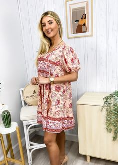 The Emes Shop dress is detailed with feminine puff sleeves. Features a floral print. tie neck detail. flowy skirt. and above knee length. Pair it with a sun hat and strappy sandals for a boho look.MATERIAL:100% ViscoseMEASUREMENTS: Product Length 35"-37.5"in 4-6-Small | Waist: 25"-26.5"in | Chest: 33"-34.5"in | Hips: 33.5"-35"in 6-8-Medium | Waist: 26.5"-28"in | Chest: 34.5"-36"in | Hips: 35"-36.5"in 8-10-Large | Waist: 28"-29.5"in | Chest: 36"-37.5"in | Hips: 36.5"-38"in 10-12-X-Large | Waist: