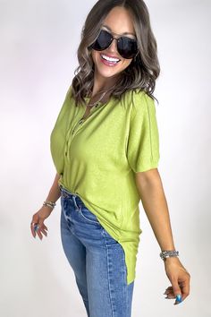 Introducing our Sweet Sunshine Light Green Henley Top! This playful piece features a button neck for easy wear and a trendy high low hem. Perfect for adding a touch of fun to your wardrobe. (Button up your style game with this charming top!) Fit: She is wearing her true size medium. Fits true to size. If in between sizes, size up.