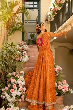 Royal Front Open Pishwas Lehenga Pakistani Bridal Dress in alluring orange shade comes in premium fabric. Hand-crafted embellishments of kora dabka and shimmering ornaments make this stunning Pishwas Dress your foremost priority for the most important day of your life. Pishwas: Pakistani Bridal Pishwas in premium silk net is an epitome of tradition and elegance. Traditional designs and golden details make this beautiful Pishwas Frock a charismatic masterpiece. Crystals, sequins, gota, and tilla Orange Georgette Sharara With Traditional Drape, Orange Georgette Sharara For Festivals, Orange Georgette Sharara With Zari Work, Orange Georgette Sharara For Wedding, Anarkali Orange Sharara With Zari Work, Unstitched Orange Sharara With Traditional Drape, Orange Georgette Sets For Reception, Bollywood Style Orange Sharara For Eid, Festive Semi-stitched Orange Sharara