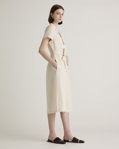 This midi linen dress should be in every wardrobe. Made from 100% organic linen and designed to be versatile, with elegant buttons down the front, and two pockets at the waist, and adjustable removable belt for the perfect fit.  | Quince | Women's Short Sleeve Dress in Sand, Size Medium, Linen Elegant Knee-length Linen Dress With Relaxed Fit, Chic Relaxed Fit Linen Midi Dress, Belted Linen Dress For Daywear, Knee-length Linen Midi Dress For Daywear, Elegant Belted Linen Dress For Work, Midi Length Linen Dress For Workwear, Fitted Linen Shirt Dress For Work, Elegant Beige Linen Workwear Dress, Elegant Relaxed Fit Linen Dress For Work