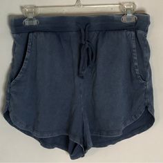 A Pair Of Pale Blue Pull-On Lounge Shorts Featuring An Elastic Waistband, A Shoelace Drawstring Tie, And Double Pockets Across The Front. New With Tags! Size: Medium. Blue Drawstring Shorts For Leisure, Blue Drawstring Leisure Shorts, Leisure Blue Drawstring Shorts, Blue Drawstring Bottoms For Leisure, Comfortable Blue Beach Shorts, Blue Stretch Shorts With Drawstring, Blue Stretch Drawstring Shorts, Comfortable Blue Summer Bottoms, Comfortable Blue Bottoms For Vacation