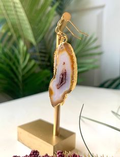 These stylish agate earrings feature a unique contrast between golden orange, milky white, and maroon. The stones are 24k gold edged and will add a striking pop of color to your outfit! 2 1/2'' Long 14k Gold-filled Earring Hooks Orange Agate, Agate Earrings, Milky White, Earring Hooks, Pop Of Color, Gold Filled, Color Pop, Agate, Orange