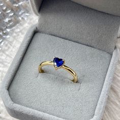 Dainty heart shaped blue sapphire solitaire gold ring, classic royal blue sapphire gemstone with 14K gold plated open band, timeless shimmery. Handmade delicate details, simple yet elegant. Minimalist subtle design, perfect for mix and match and stacking. Absolutely beautiful gift idea for your loved one and yourself! 💎 Features: ♥ Material: Finest 14K Gold plated ♥ Main stone: Sapphire zircon ♥ Open adjustable band, fits US size 4-10 💎 Details: ♥ Approximate Measurements: - Main stone Width: Sapphire Gold Ring, Gemstone Solitaire Ring, Handwritten Gifts, Natural Pearl Earrings, Engagement Rings Couple, Dainty Rings, Blue Sapphire Gemstone, Sapphire Solitaire, Band Fits