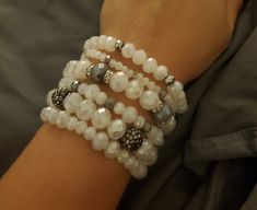 Beautiful white with metallic gray beaded bracelets that are perfect for everyday wear whether it be out and about or a night out!  They are made with stretch cord so you can slip them on and off!  Set of 6 bands.  Can customize to an extent, please message me. White Stretch Bracelet With Silver Beads, Grey Beads, Bracelets Set, Sarasota Fl, Glass Beaded Bracelets, Grey Glass, Out And About, Sarasota, Stretch Bracelets