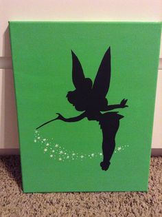 a green box with a silhouette of a tinkerbell on it