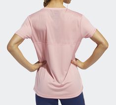 the back view of a woman in pink running clothing