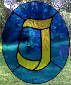 a stained glass window with the letter u in it