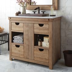 a bathroom with a sink, mirror and towel rack on the wall next to it