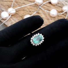 "PRODUCT DETAILS: ★ Completely Natural Gems Comes With \"Lab Certification\" ★ Natural Columbian Emerald : 3.10 CARAT.    \"Weight Can Vary\" ★ CUT: OVALCUT 7X10MM ★ Material: 18K White Gold  \"Customisation can be done In 14K\" ★ Gross Weight: 4 GRAMS    \"Weight Can Vary\" ★ 18K Gold Weight: 3.30 GRAMS ★ Natural Diamond Weight: 0.55 CARAT.     \"Weight Can Vary\" ★ Natural Diamond Colour/Clarity: G-H/VS1 ROUND BRILLIANT CUT ★ READY TO SHIP IN 7-10 BUSINESS DAYS ★ All Jewellery will Be Authentic  \"Lab Certified\". ★ All Product Images Are Real-Time Images, Our Policy Is What You See On Our Site Is      Exactly What You Will Get, Customer Satisfaction Is Our Top Most Priority. ★ All The Gems Are Completely Natural No Heat No Treatment. ★ At GoldTale By Riya Jewels we loved making jewelry Oval Emerald Gemstones With Halo Setting, Fine Jewelry Diamond Cluster Gemstones, Exquisite Anniversary Gemstones With Halo Setting, Fine Jewelry Emerald With Center Stone, Exquisite Gemstones With Halo Setting Ring, Luxury Platinum Emerald Ring With Halo Design, Luxury Cluster Jewelry With Halo Design, Elegant Emerald Gemstones With Center Stone, White Gold Diamond Cluster Ring - May Birthstone